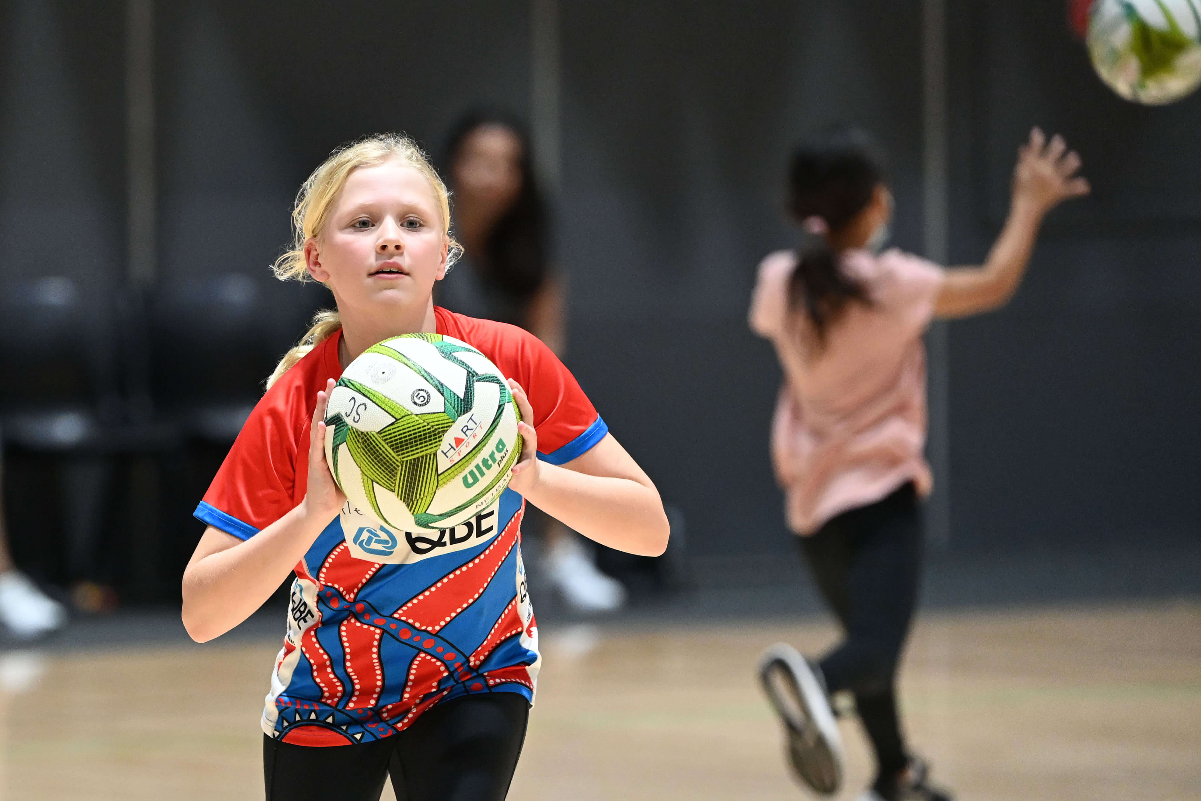 Young people practising netball