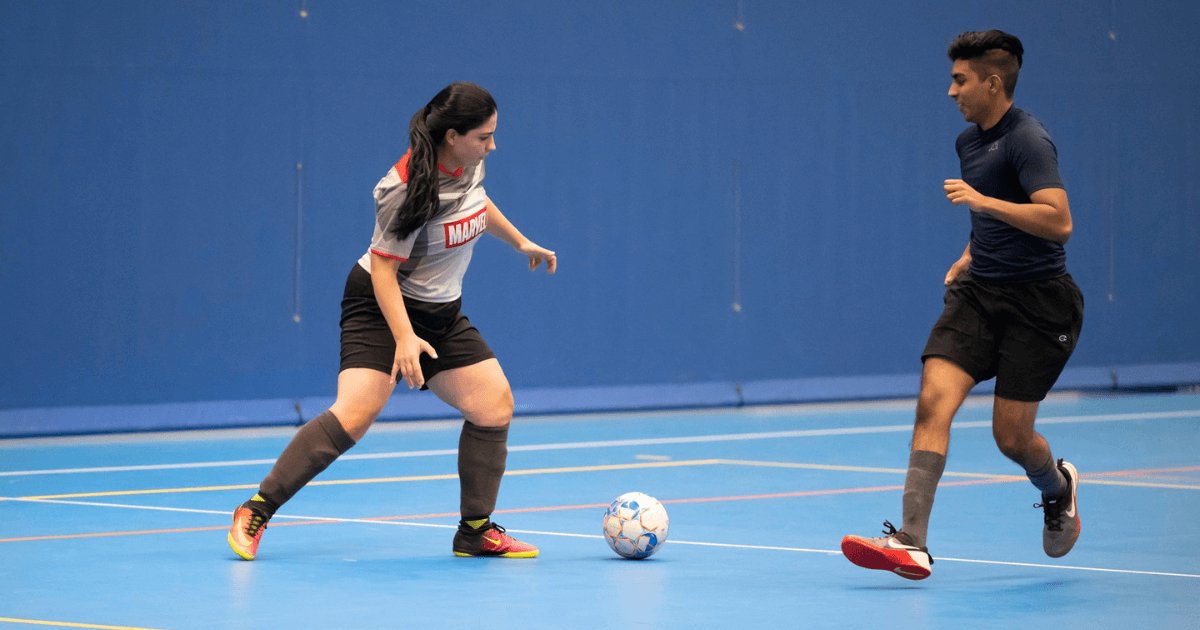 People playing indoor soccer