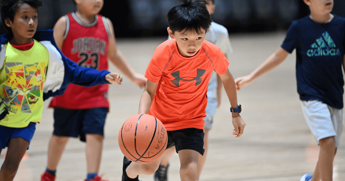 Young kids learning basketball