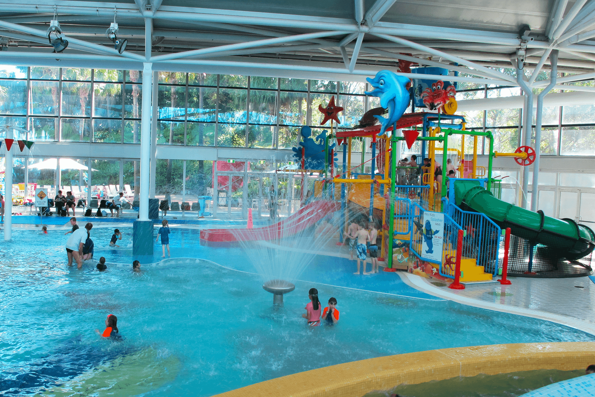 A water playground with slides, fountains, and pools.