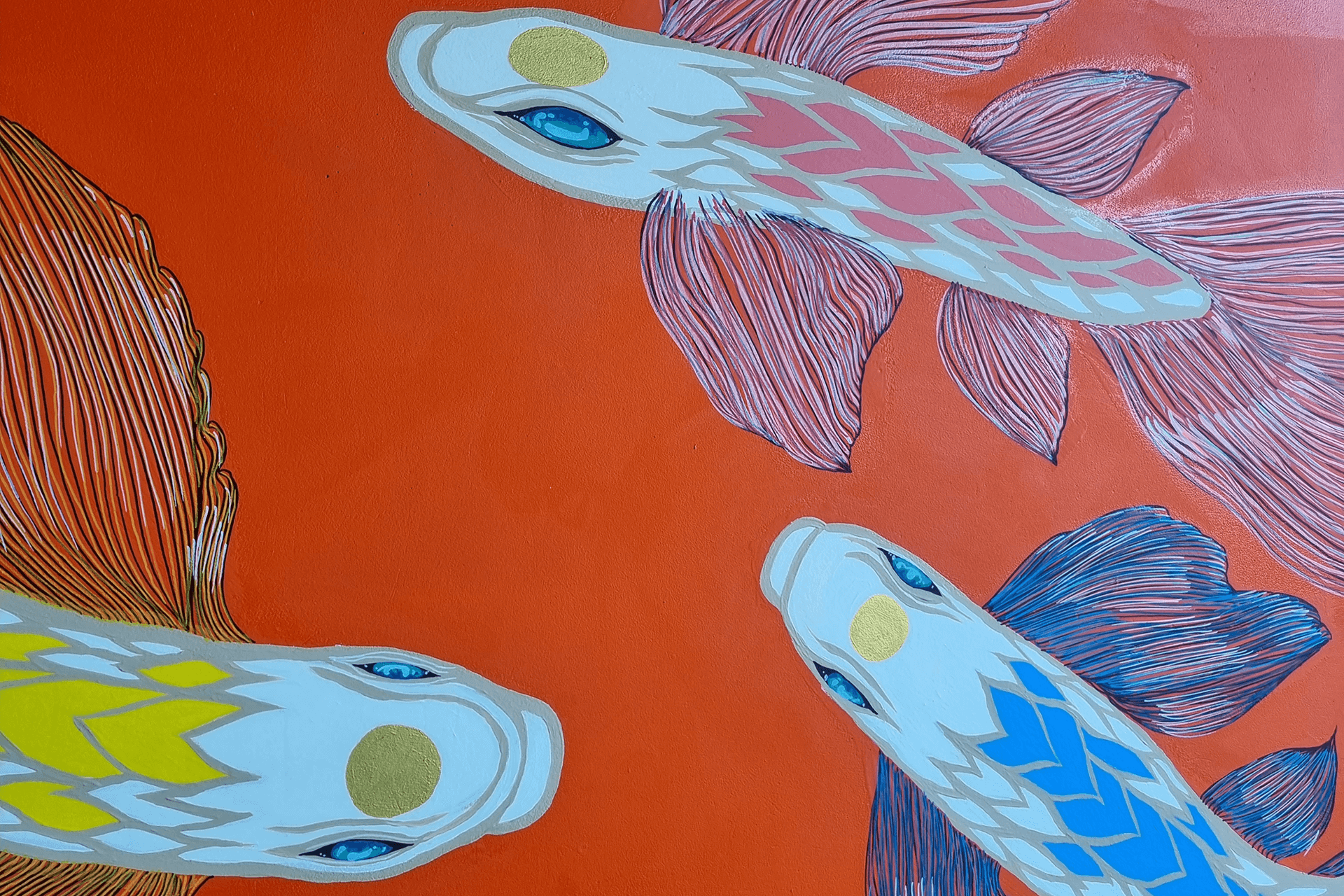 Close-up detail of koi fish depicted in mural